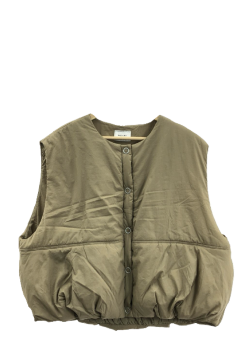 A tan puffer vest with snap buttons on the front, hanging on a hanger. The vest appears to be padded and sleeveless.