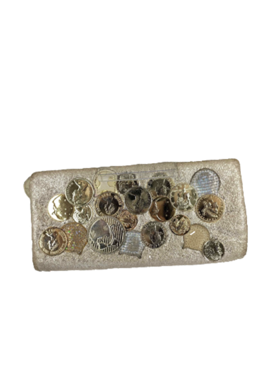 Collection of various coins displayed on a foam holder.
