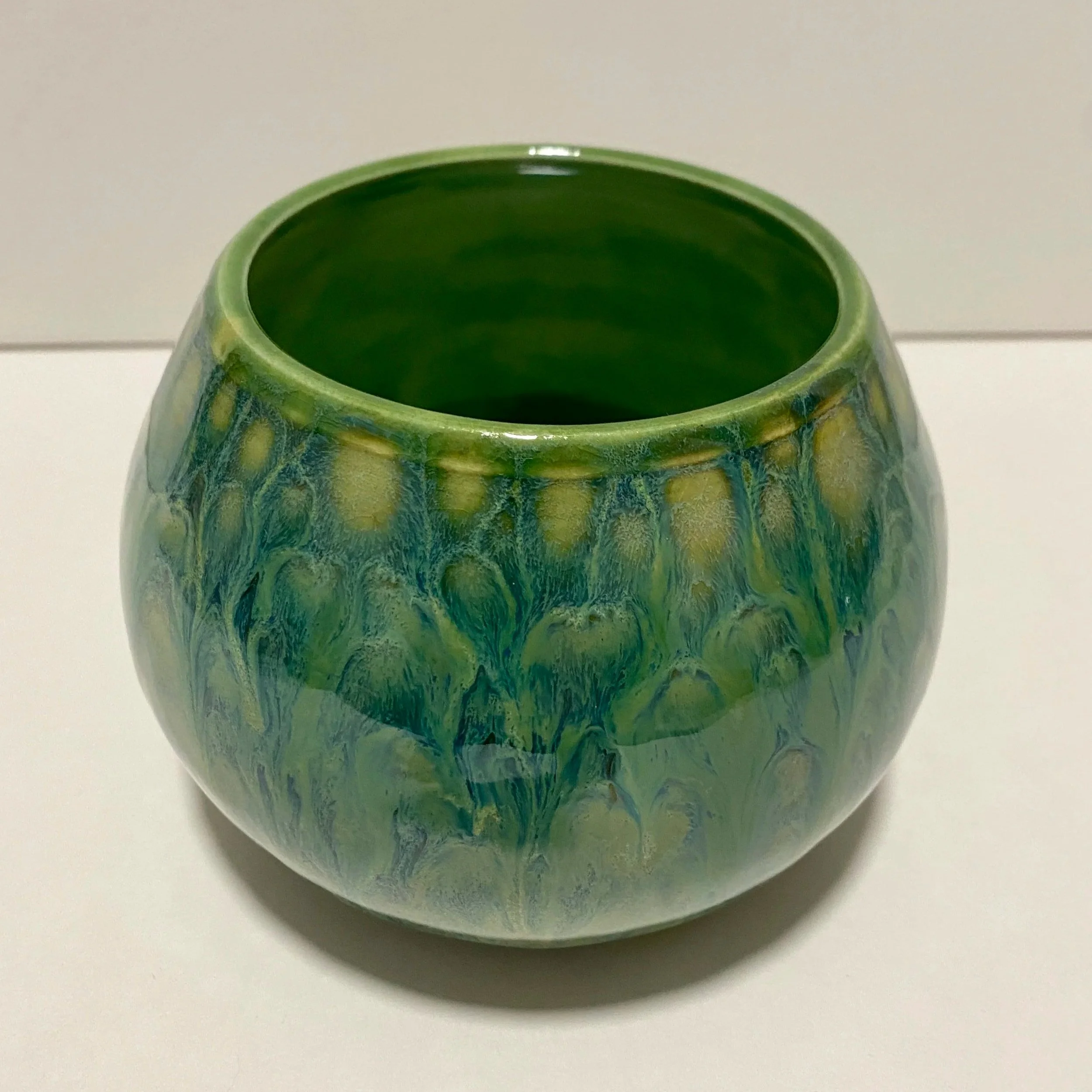 green round vase with dripping glaze