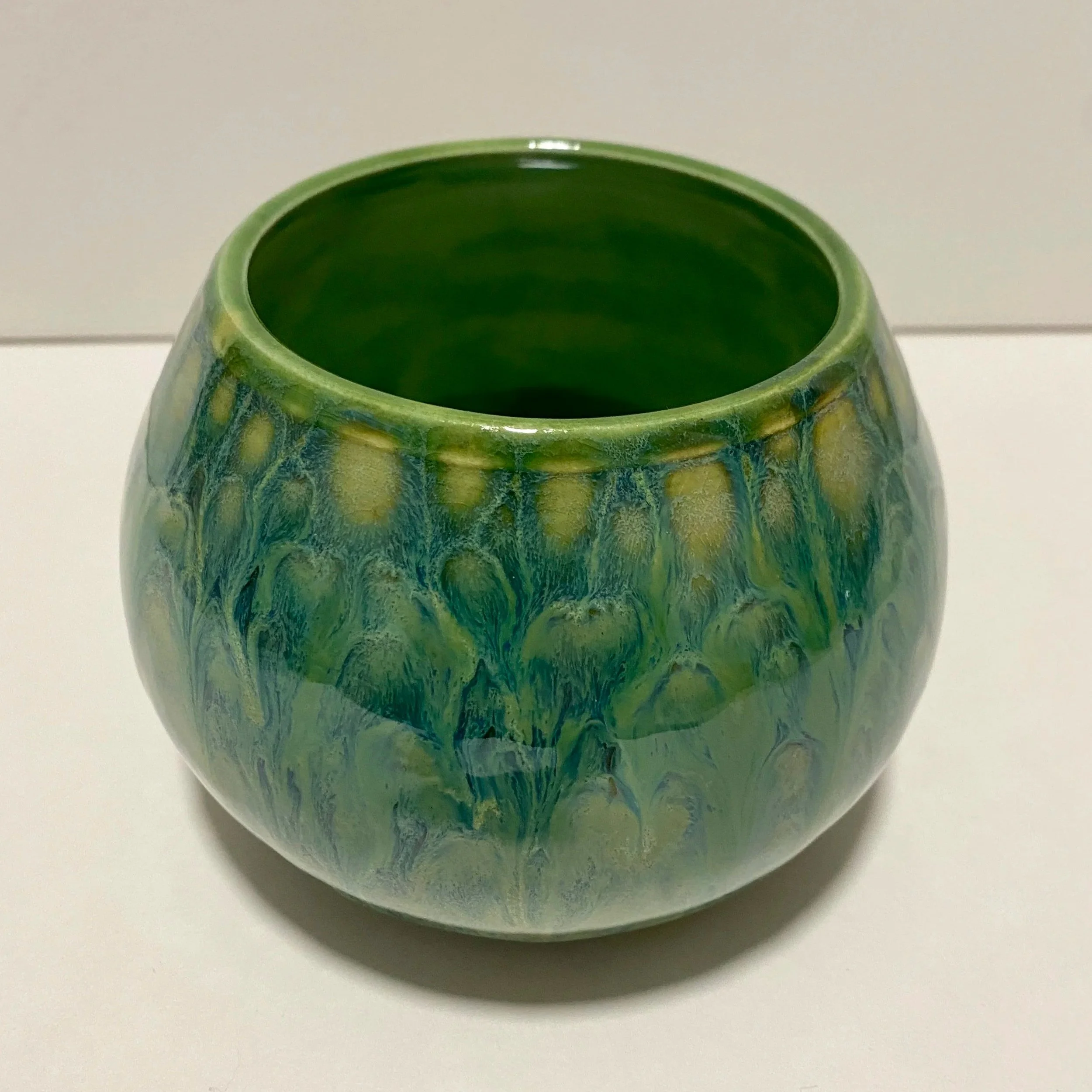 green round vase with dripping glaze
