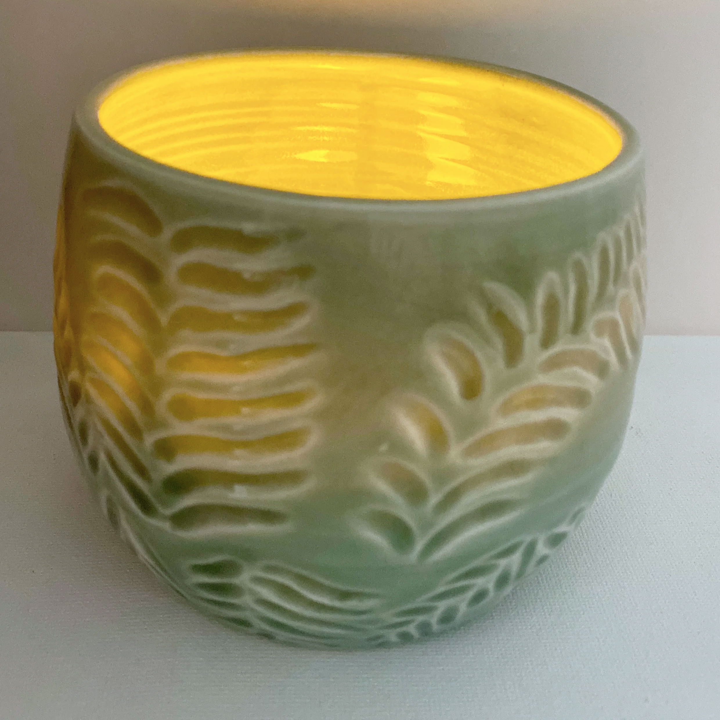 view 2 of green fern carved candle dish