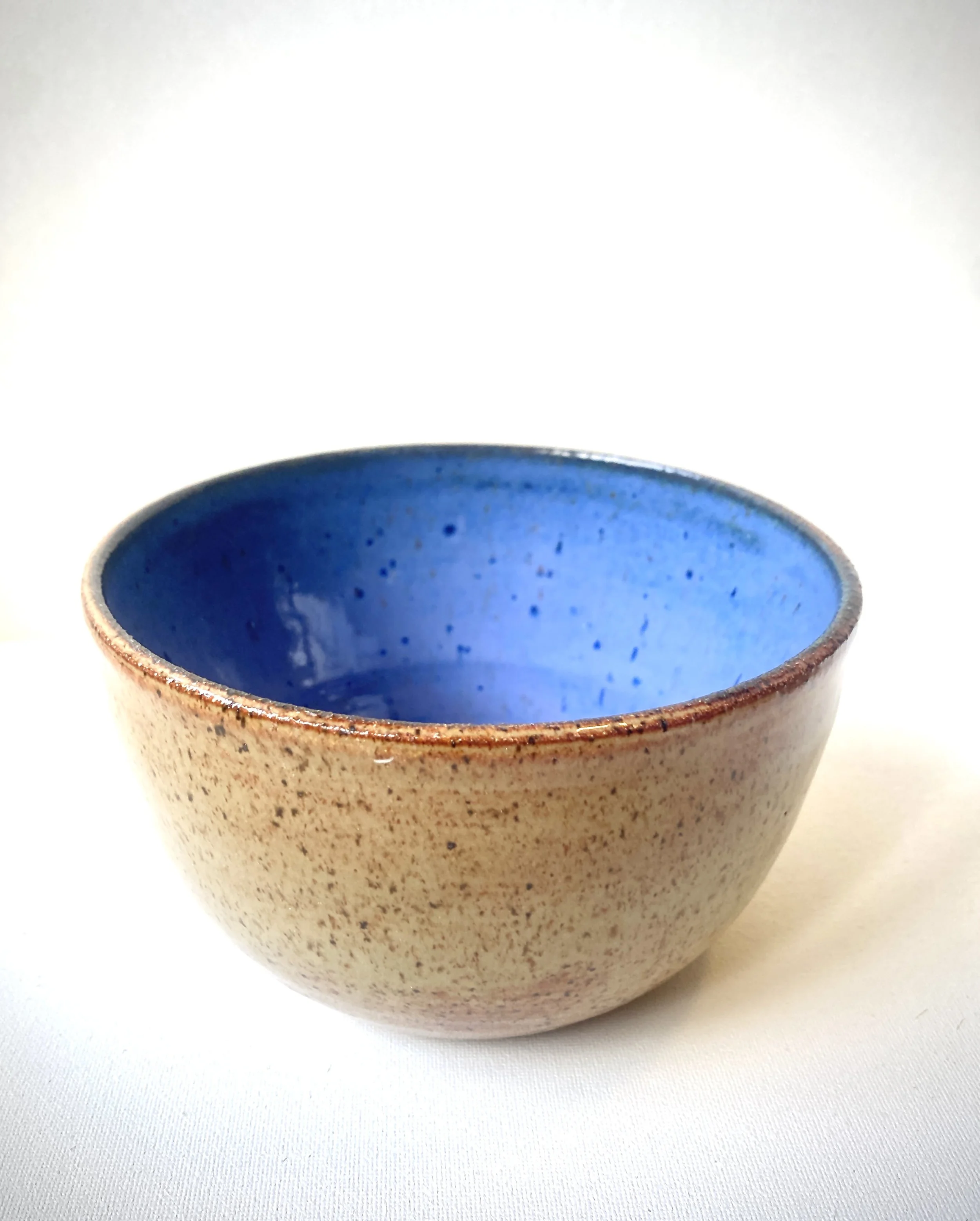 Tan and blue serving bowl