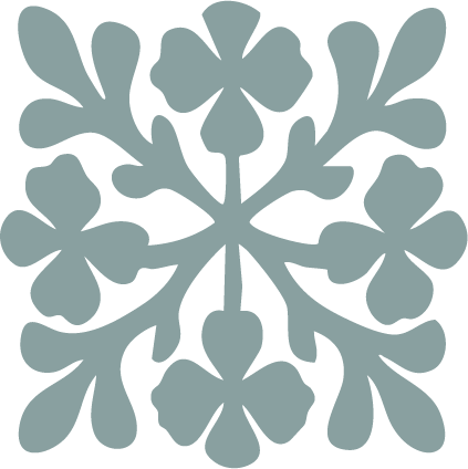 A symmetrical floral pattern resembling a snowflake or flower design in light blue against a black background.