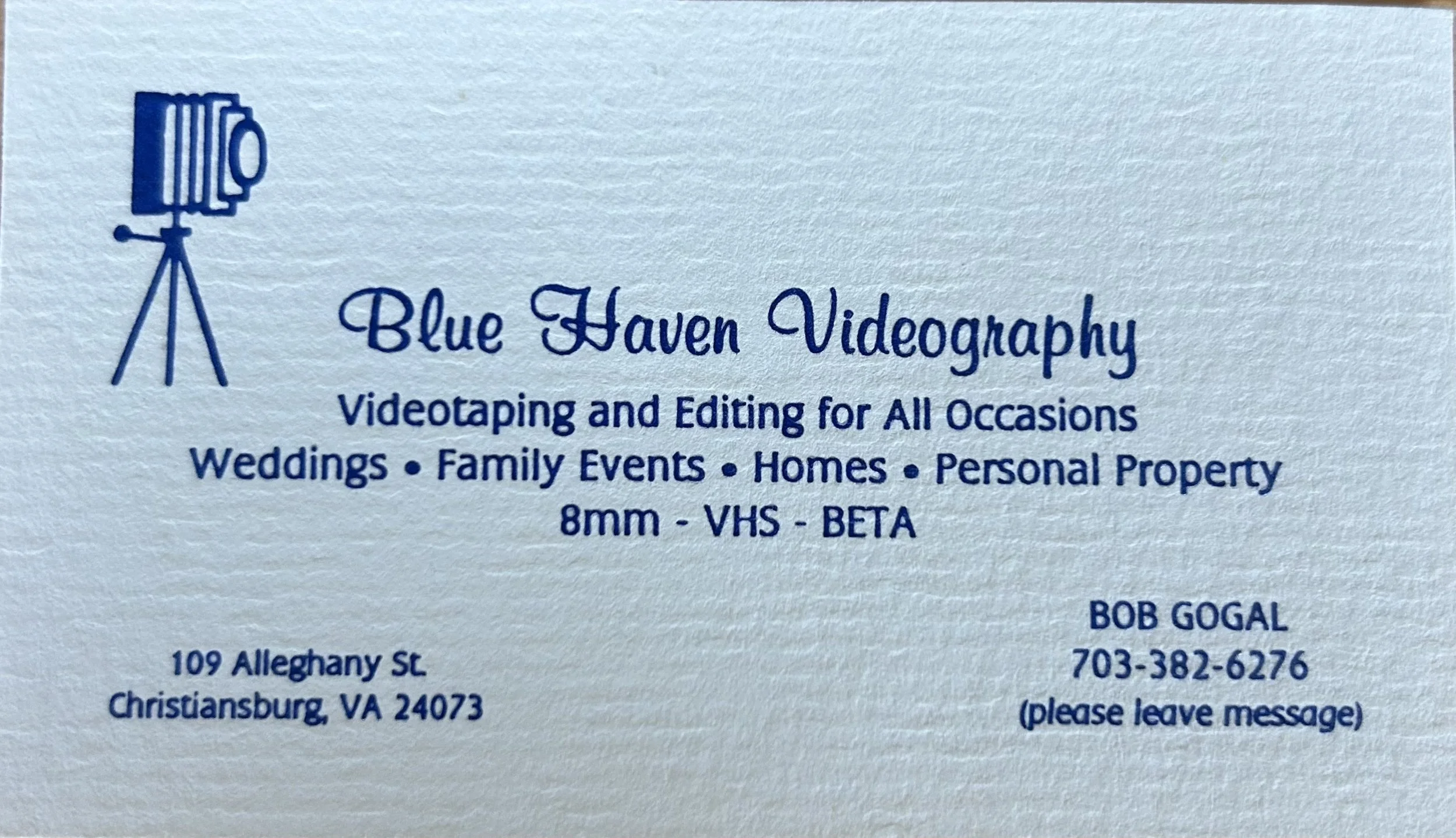 Business card for Blue Haven Videography featuring a stylized blue video camera icon on a tripod. The card includes services like videotyping and editing for occasions such as weddings, family events, homes, and personal property, with a note about specific formats like 8mm, VHS, and Beta. The bottom of the card displays the name Bob Gogal, a physical address in Christiansburg, VA, and a phone number.