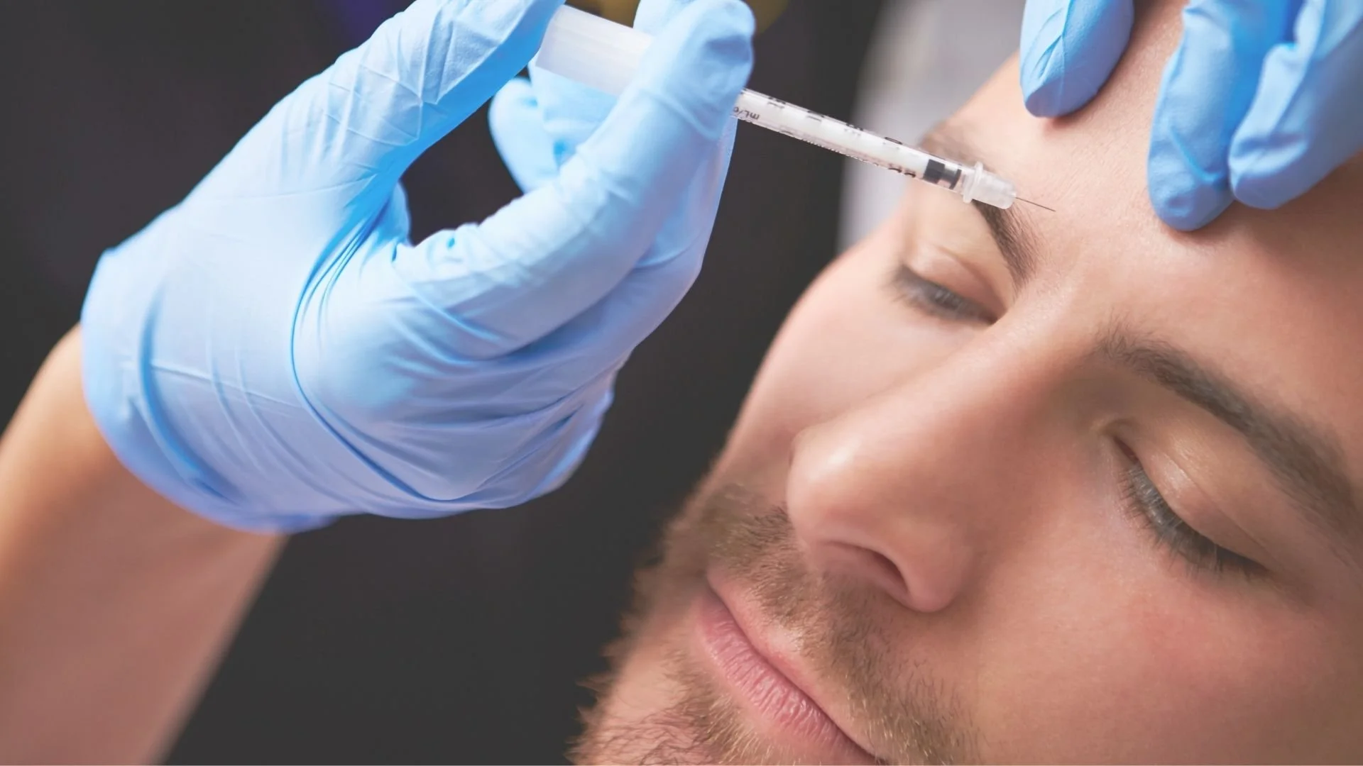 Man receiving injectable treatment to reduce facial lines