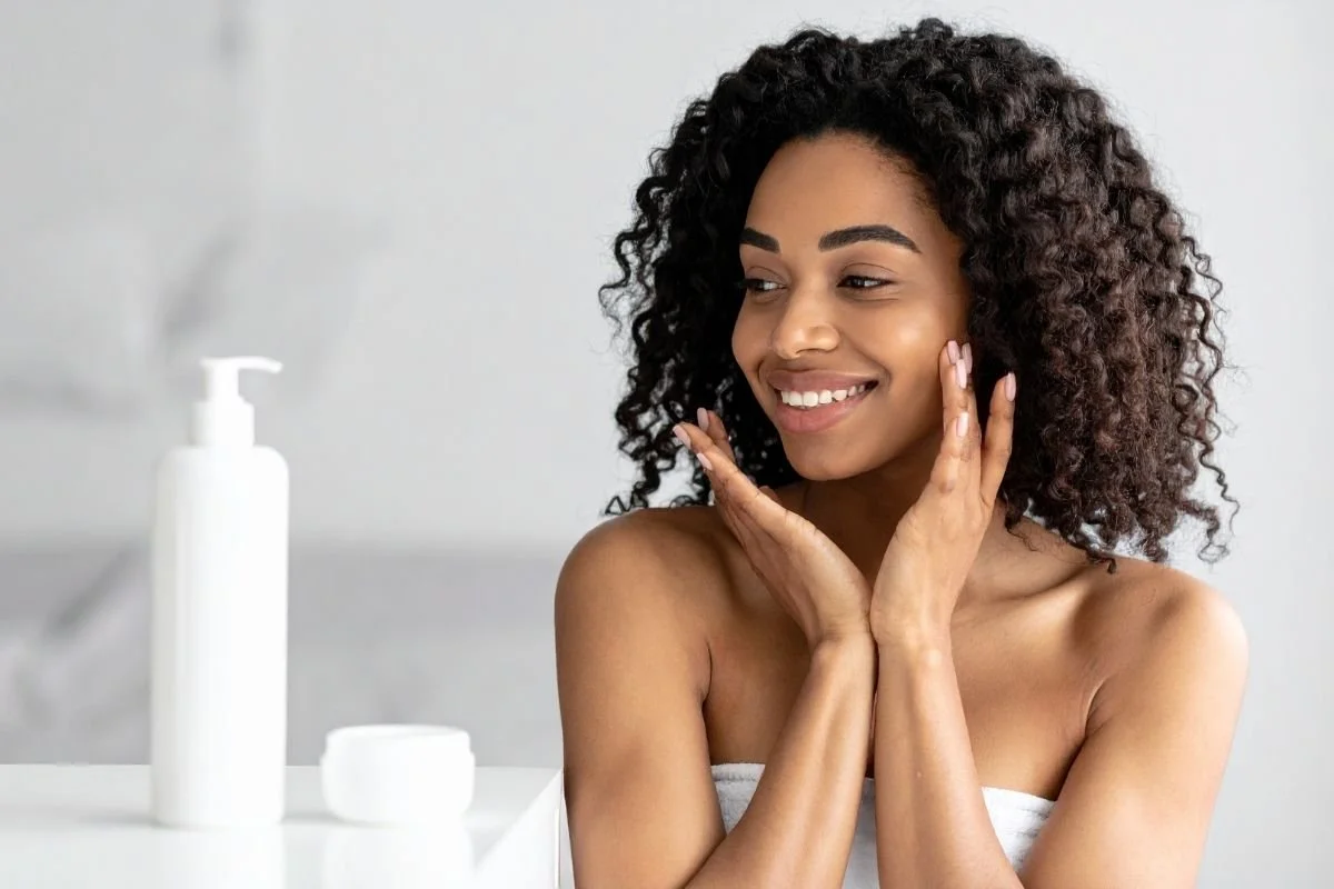 Woman using medical grade skincare.  
