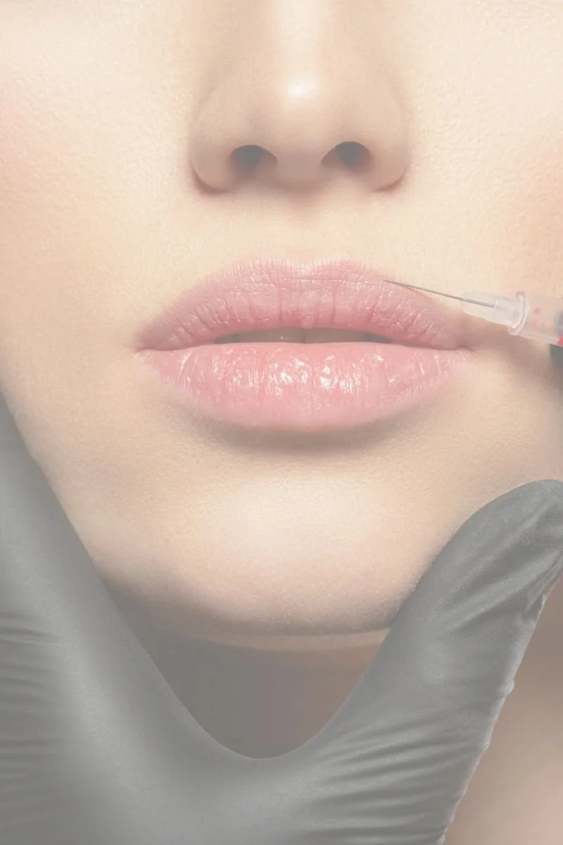 Close-up of lips during injectable treatment for aesthetic enhancement