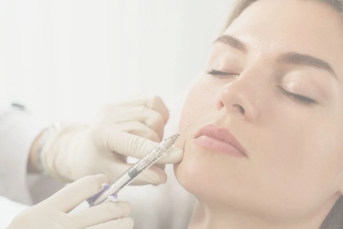 Woman receiving injectable treatment for facial rejuvenation