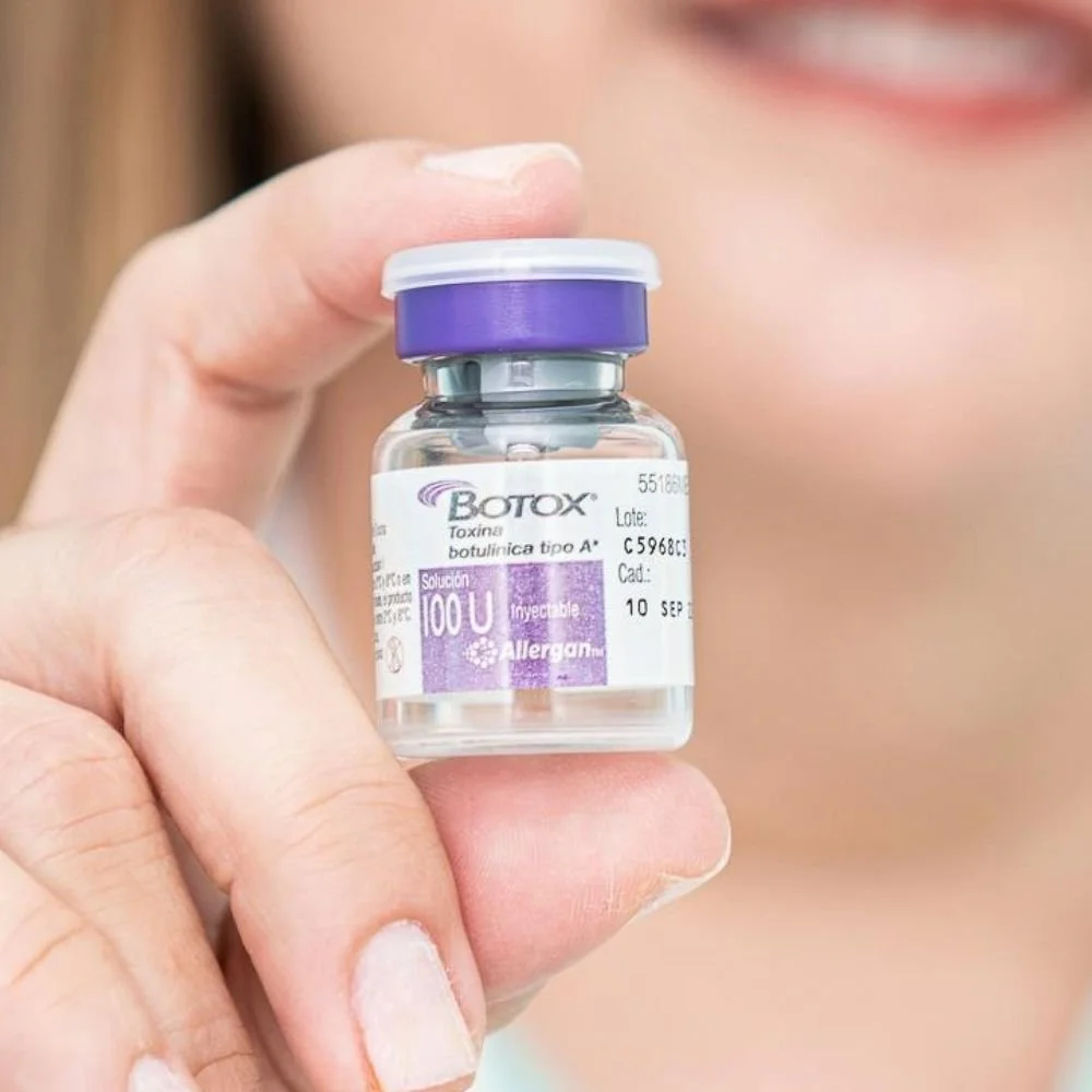 Botox vial held by provider for wrinkle relaxer treatment