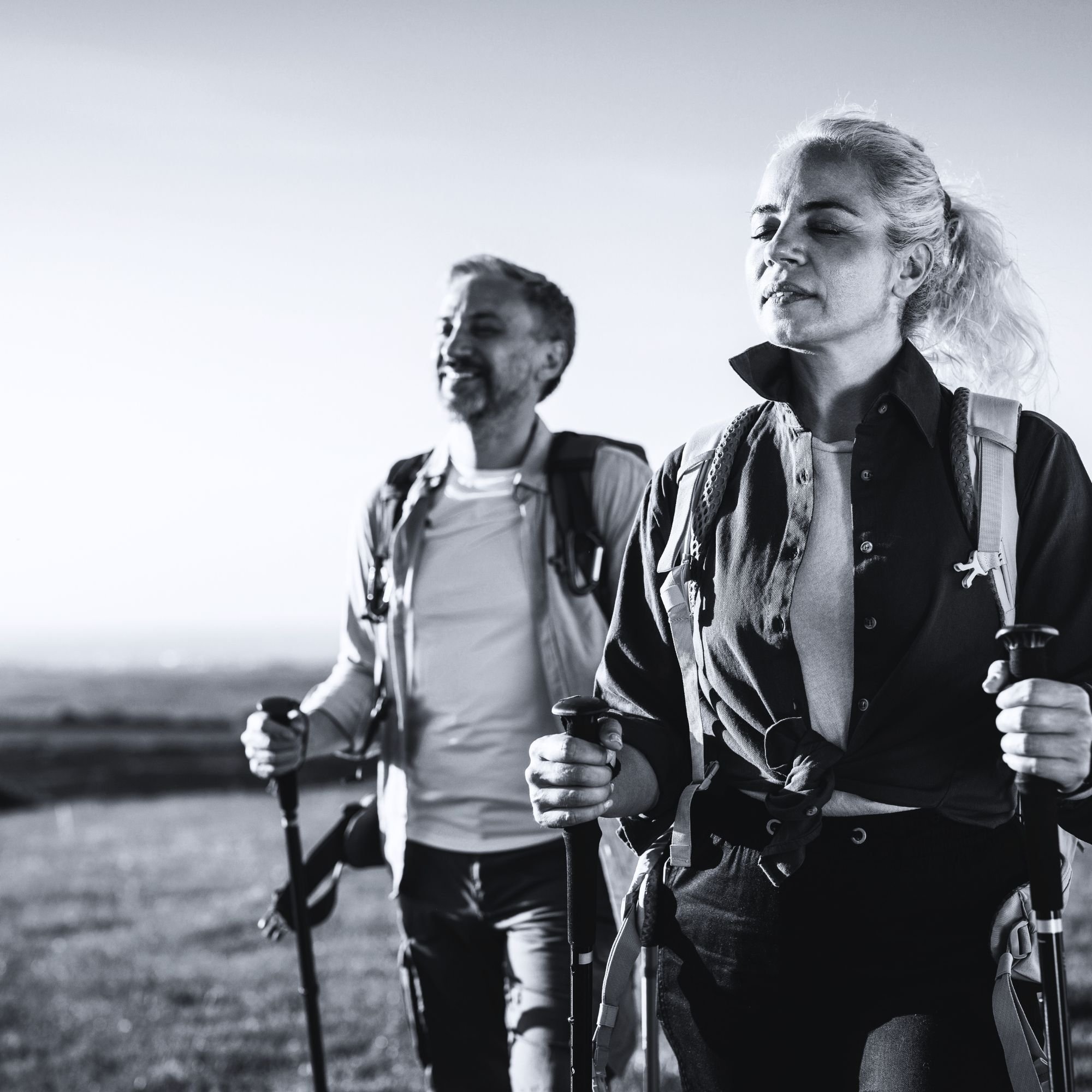 Active couple walking outdoors representing hormone optimization and healthy aging