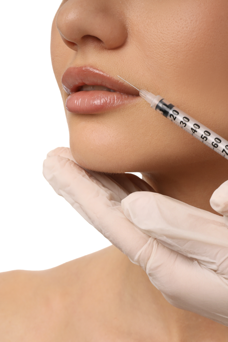 A person receiving a cosmetic lip injection from a medical professional wearing gloves.