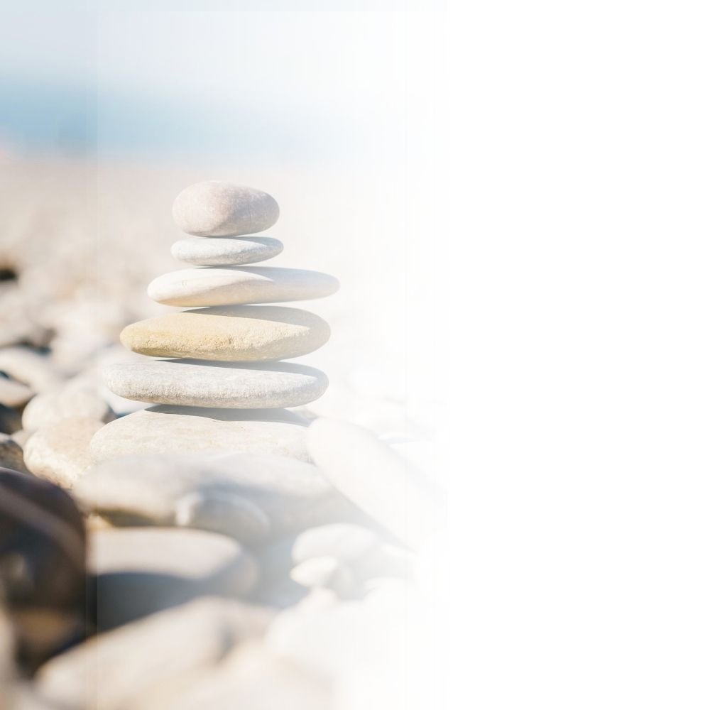 Zen rocks outside on the beach.