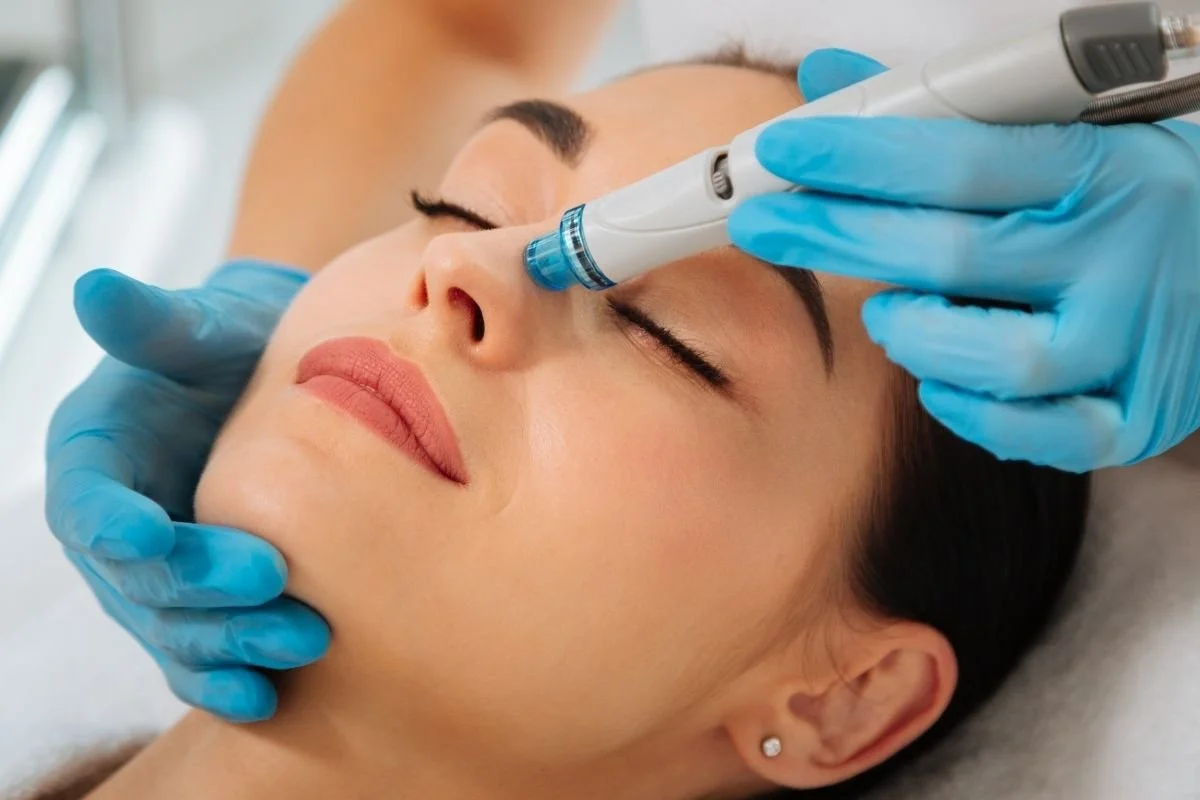 Woman receiving hydrafacial treatment.
