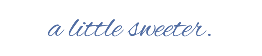 Text on a black background that reads 'a little sweeter.' in blue cursive font.