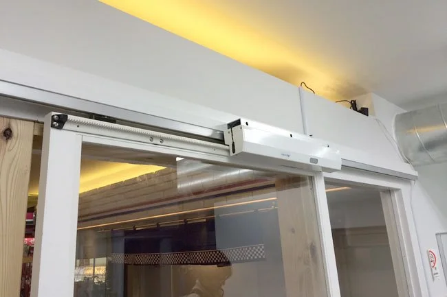 What You Should Know Before Buying an Automatic Opener to Turn Your Sliding Glass Door Into a Pet Door