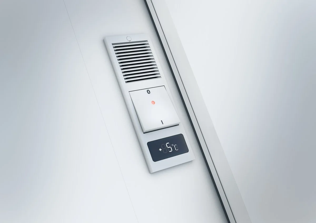 Close-up of a modern ceiling vent, light switch with a red indicator light, and a digital thermostat showing minus 5 degrees Celsius mounted on a white wall.