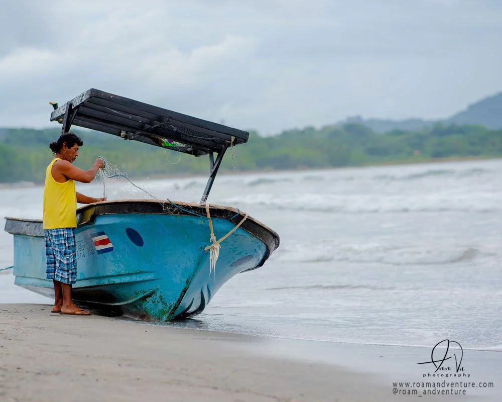 roamandventure fisherman costa rica beach
