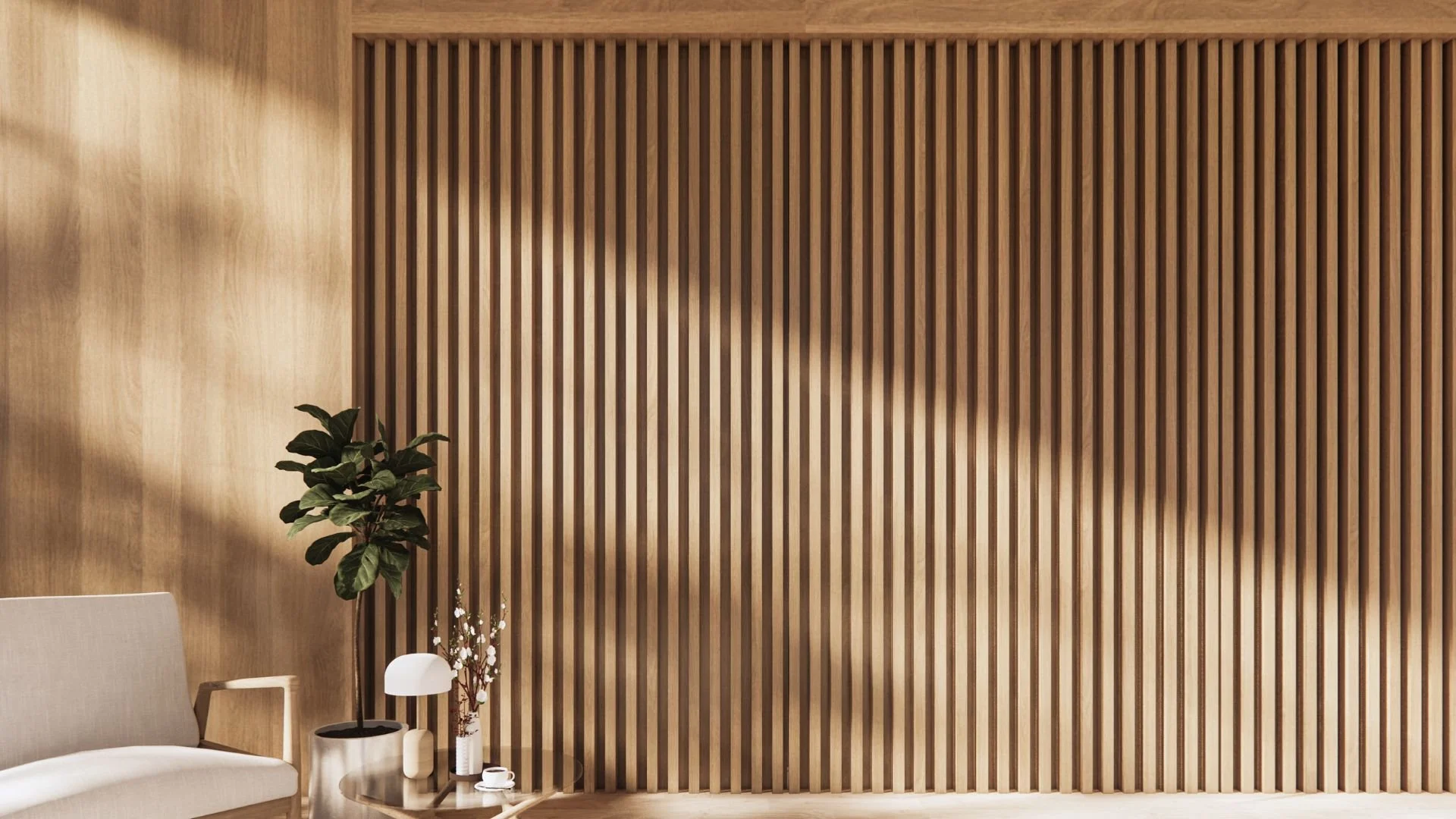 Interior living space with wooden slat wall, beige sofa, small side table with a white lamp, a vase with flowers, and tea set.