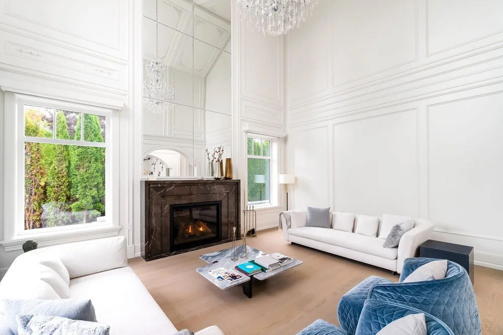 Living+room+with+fireplace+and+white+couches+built+by+Batista+properties.jpg