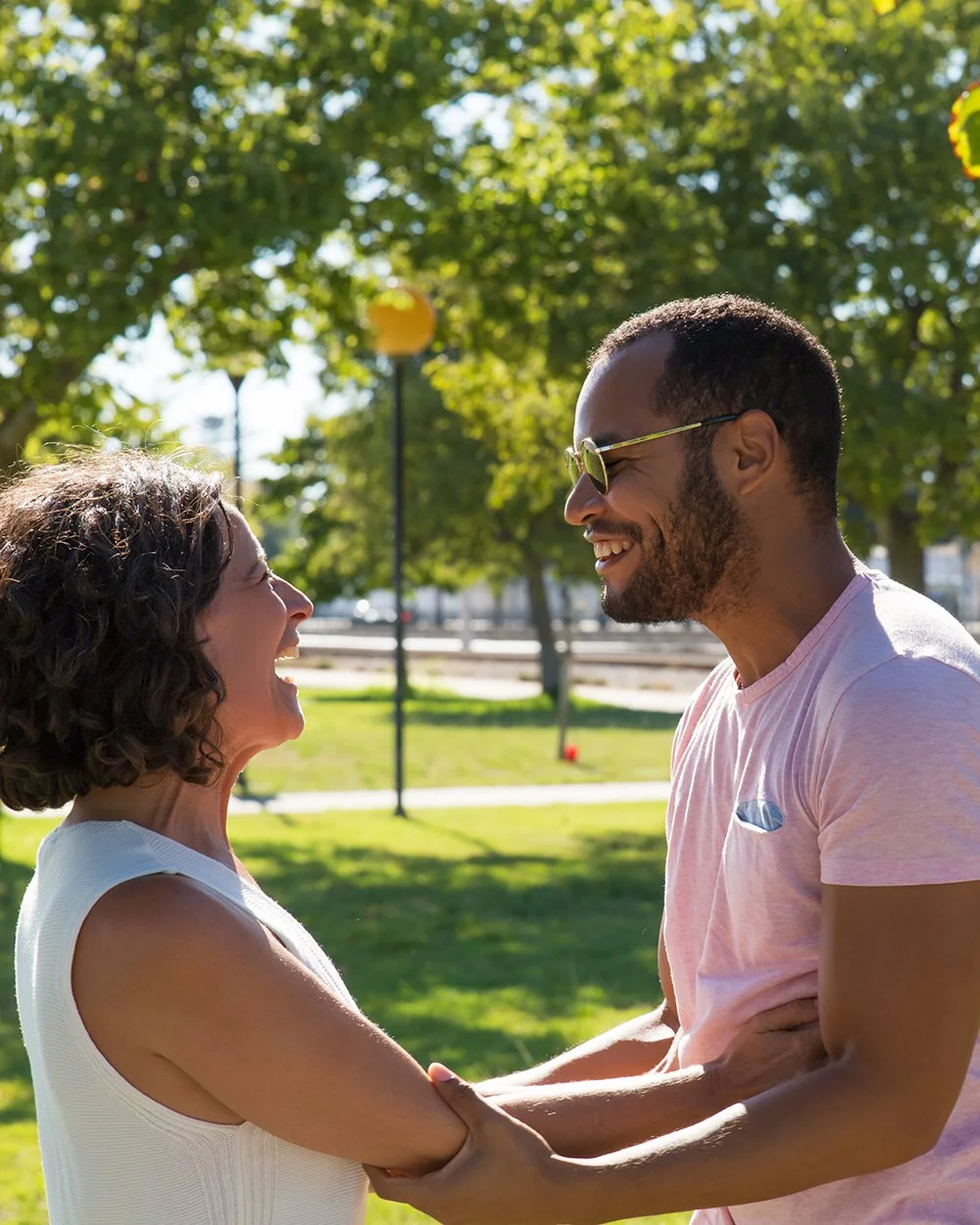 Smiling couple talking together outdoors