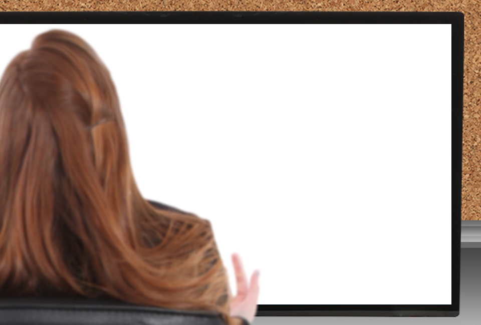 A woman with red hair sitting in front of a computer screen displaying a disrupted or corrupted webpage.