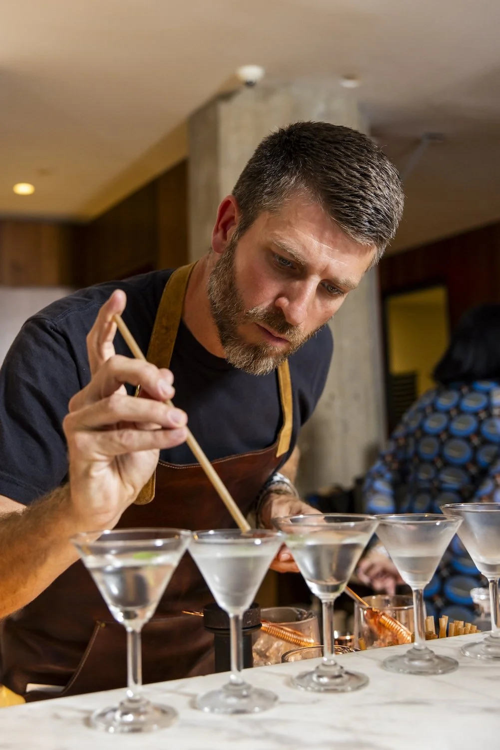 Talent at Martini Expo making martinis.