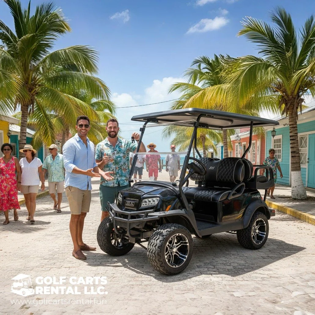 Two men in summer clothes standing beside a black golf cart on a sunny street lined with palm trees and colorful buildings, with a small group of tourists in the background.