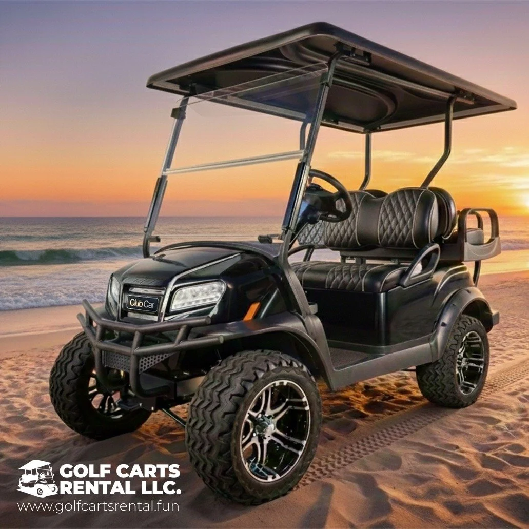 Black golf cart on sandy beach at sunset with the ocean and sky in the background. The golf cart has diamond-stitched leather seats and a roof. There is a logo for Golf Carts Rental LLC and a website at the bottom left corner.
