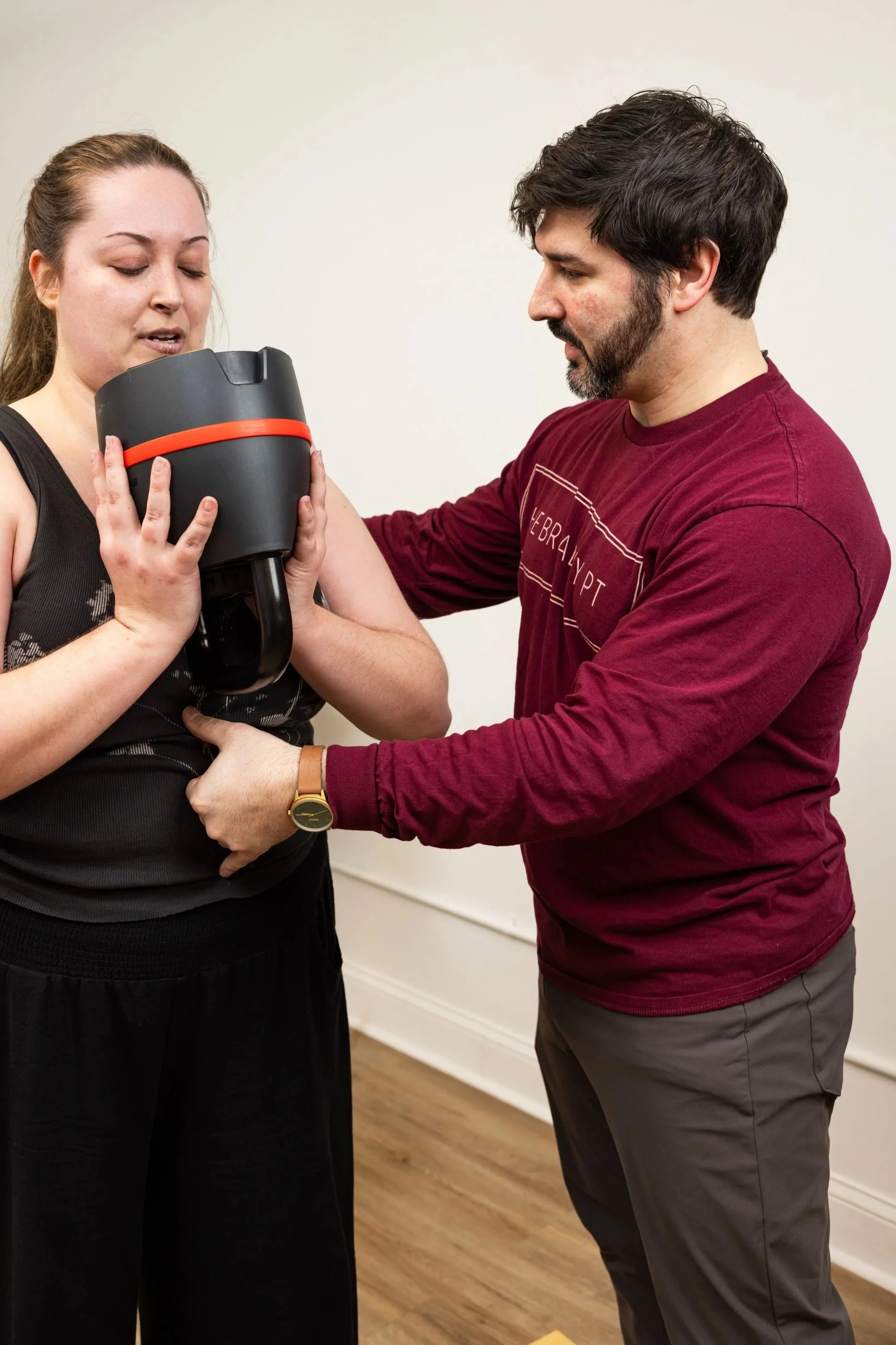 Dr. Anthony Sacramento, PT, DPT, CSCS working with a patient in his practice.