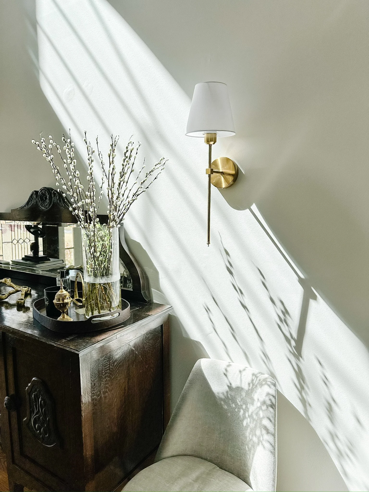 Antique entryway console with natural light and sconce--Casa Limones interior design