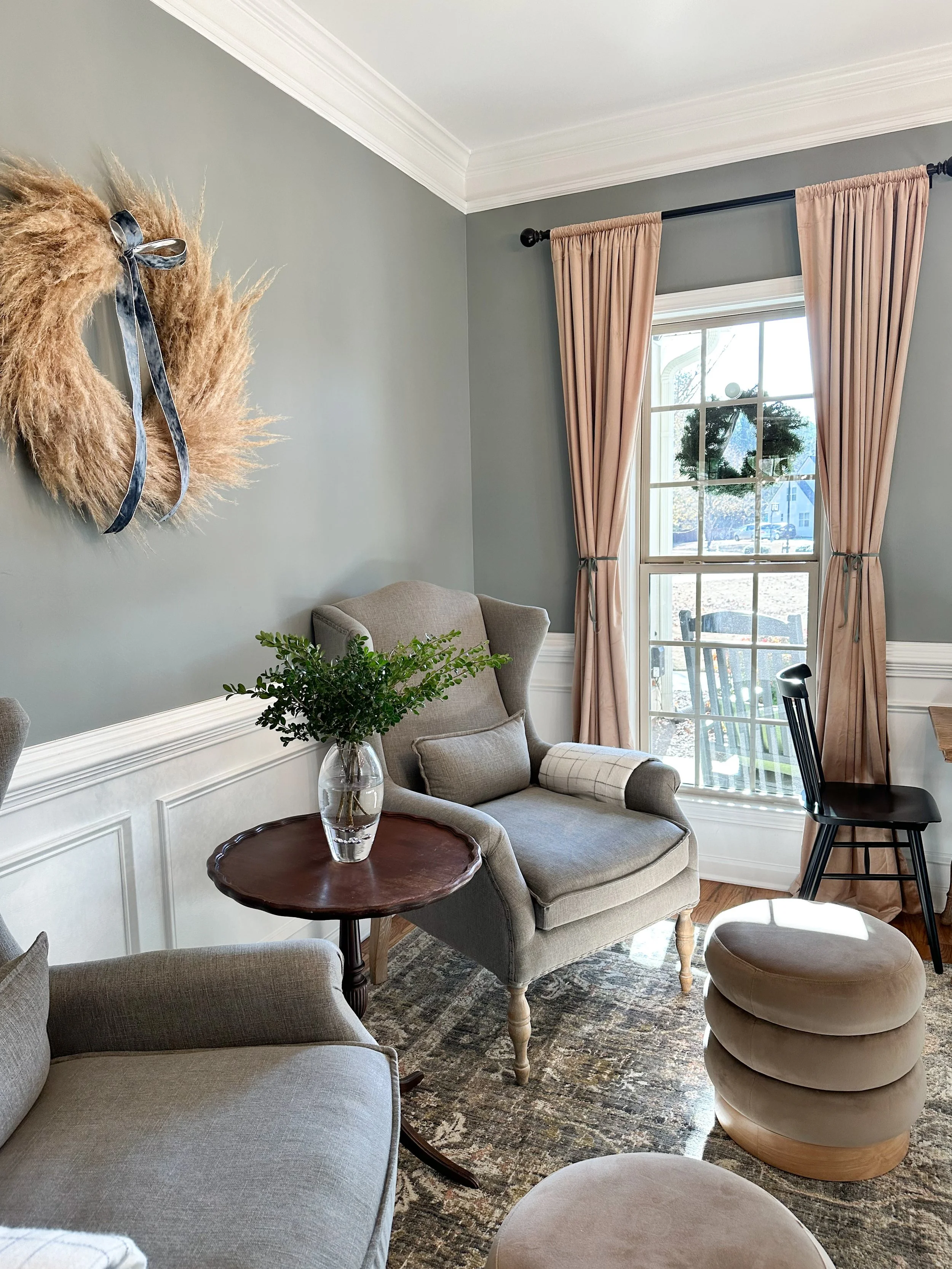 Parlor sitting area with wingback chairs and vintage rug--Casa Limones interior design