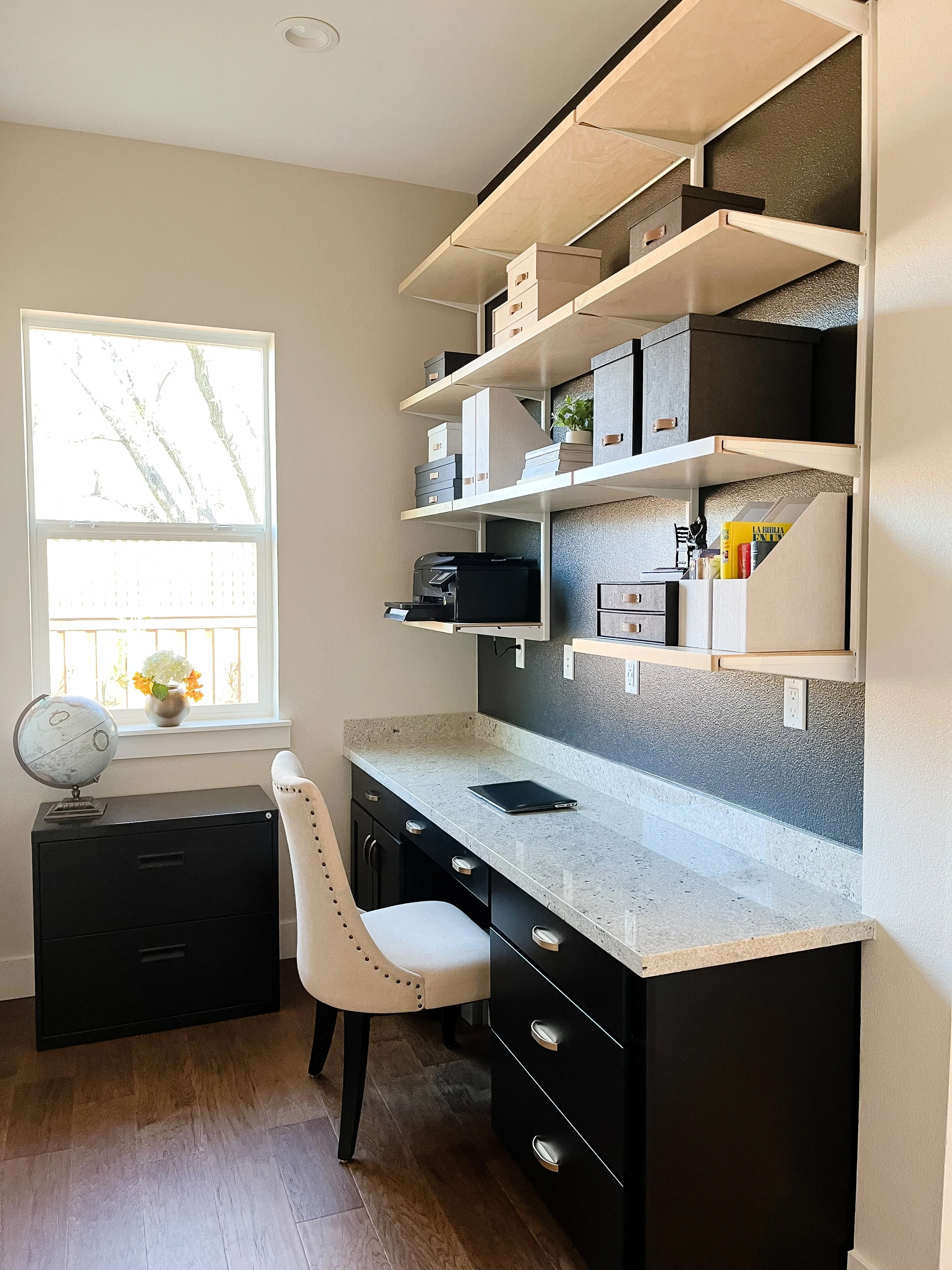 Home office with black and light oak furnishings, brass accents--Casa Limones interior design