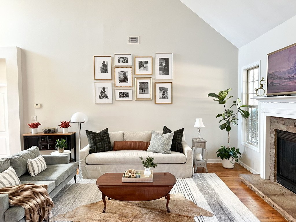 Warm neutral living room with cowhide rug, light grey sofa, and light beige sofa--Casa Limones interior design