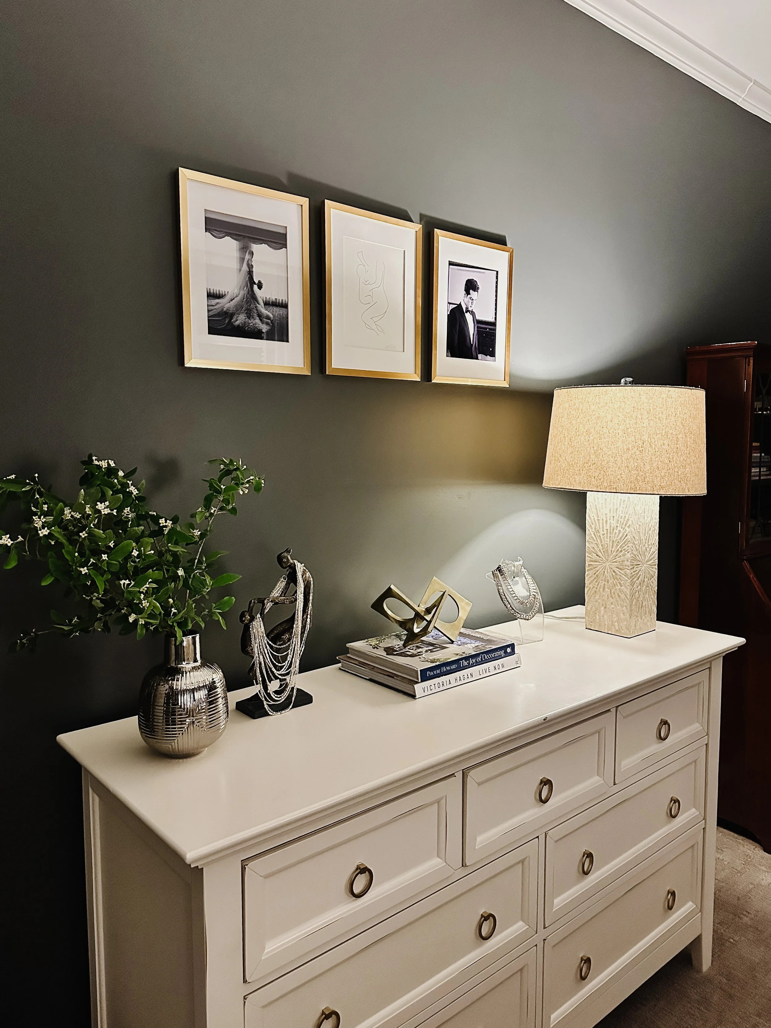 White bedroom dresser with metal accessories and gallery wall--Casa Limones interior design