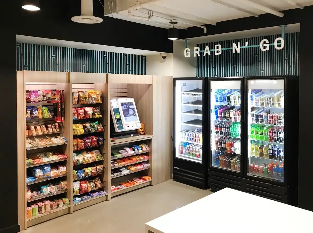 Snacks and beverages in vending machines in a retail store, with a sign that reads "Grab N-Go."
