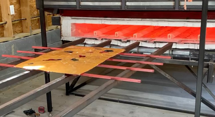 Diana Ahrens melting vitreous enamel in custom furnace.