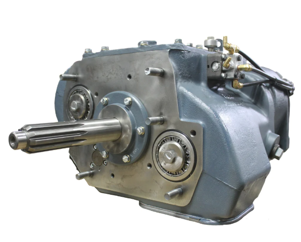 Close-up of a black mechanical component, likely a hydraulic or pneumatic valve, with mounting brackets and control mechanisms.
