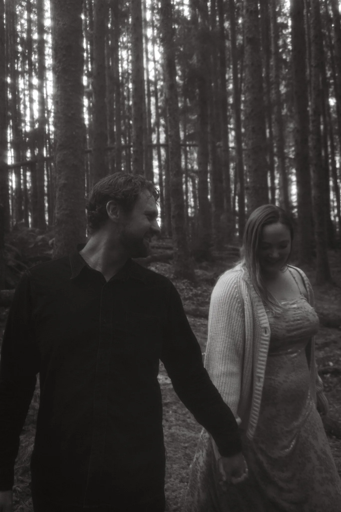 black and white photo of couple holding hands engagement shoot humboldt county california redwoods