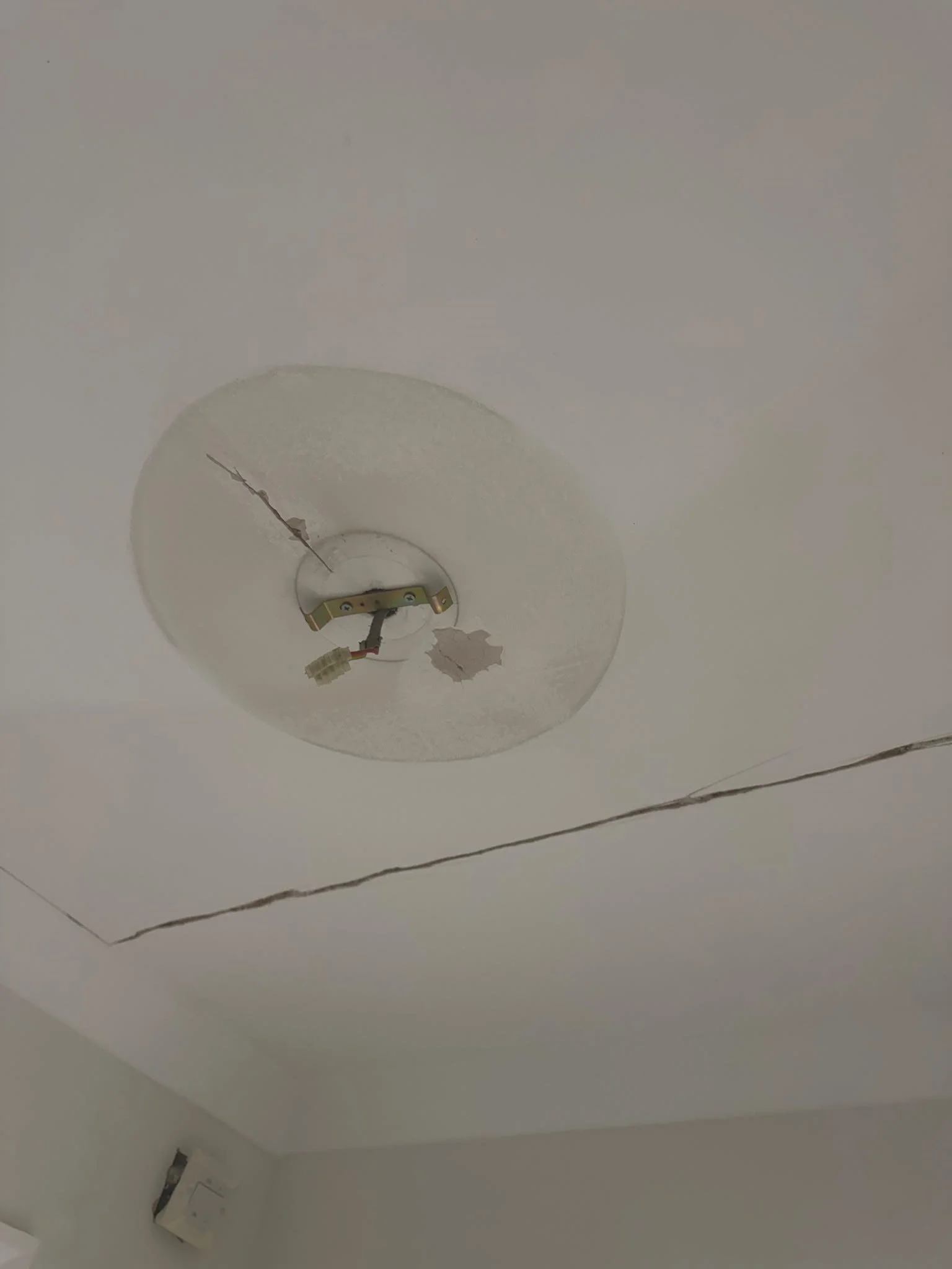 cracked-ceiling-and-damaged-plaster-before-repair.jpg