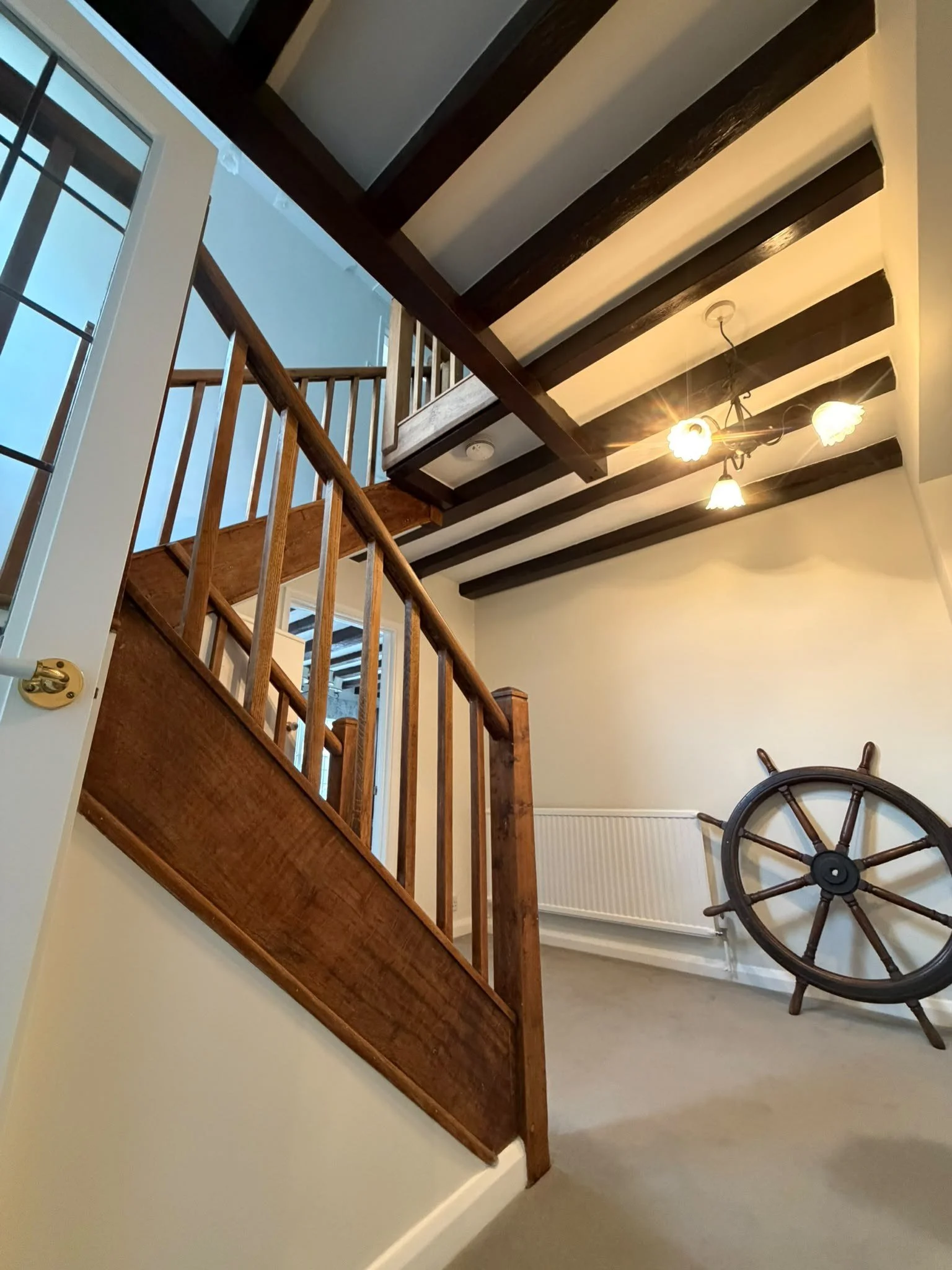 finished-oak-staircase-under-stained-beams.jpg