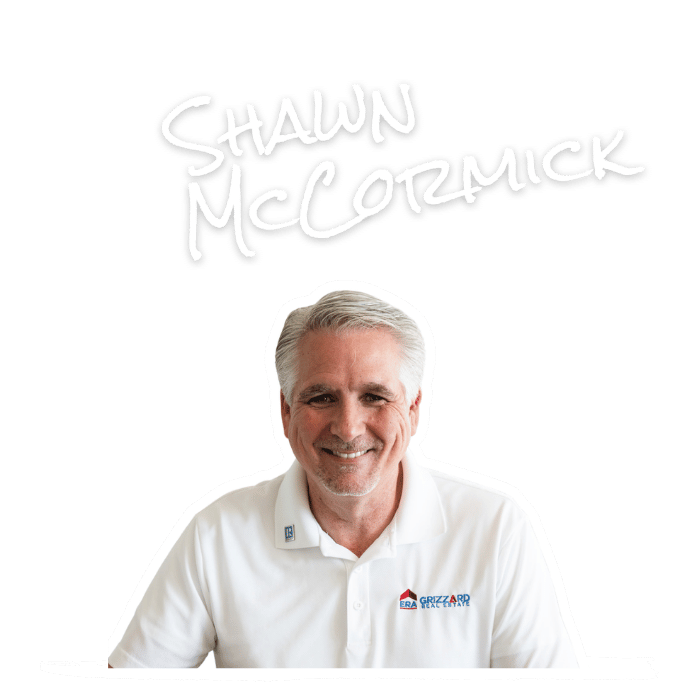 Photograph of Shawn McCormick wearing a white polo shirt with a logo, smiling, with his name written in white handwritten style above.