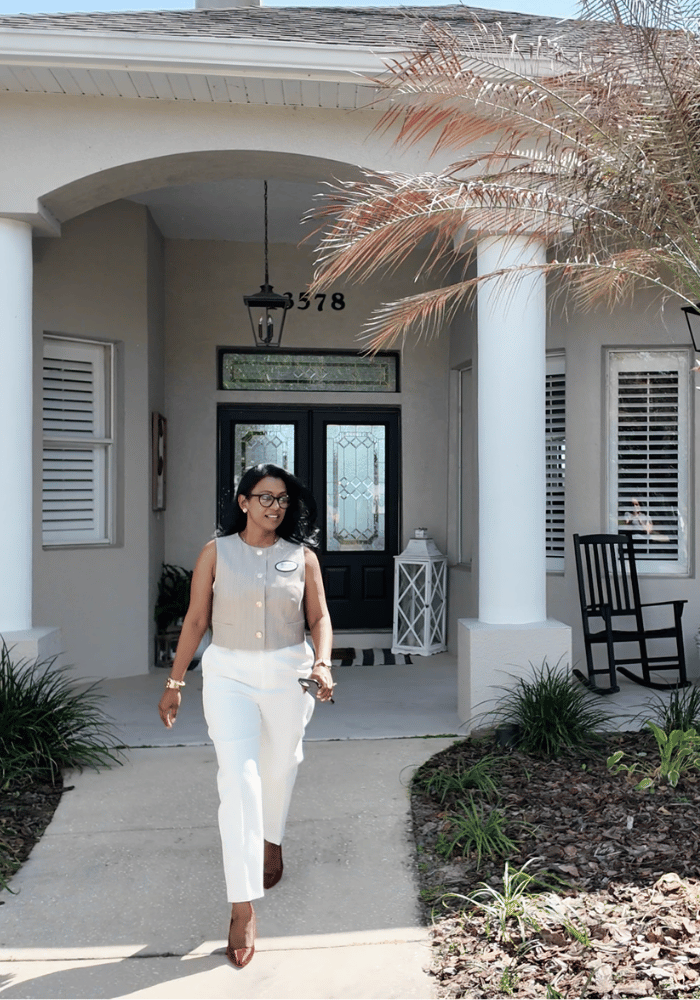 Narisha Ally, Listing Agent and REALTOR® with ERA Grizzard Real Estate in front of a home in Central Florida