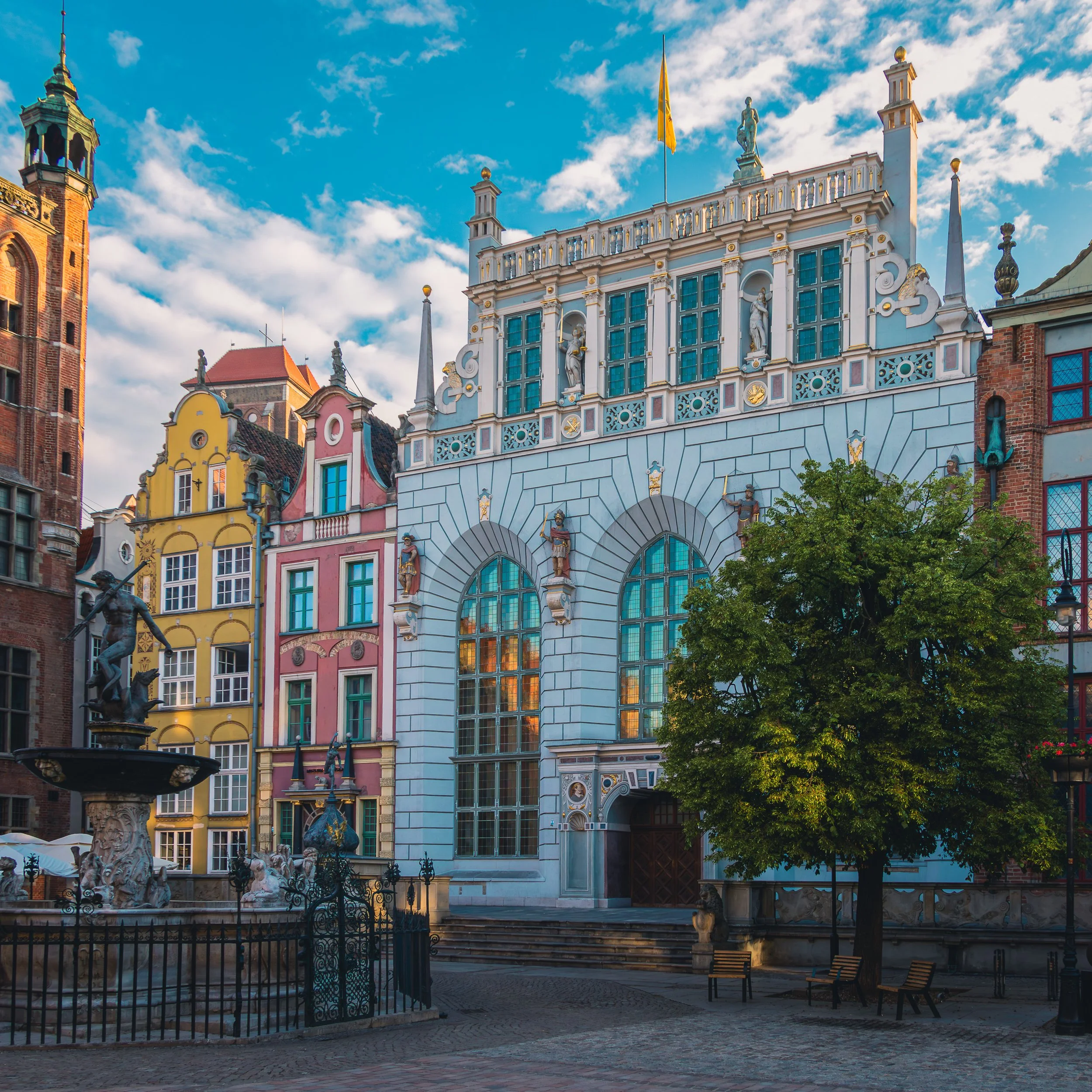 Neptune statue framed by historic architecture in Gdańsk