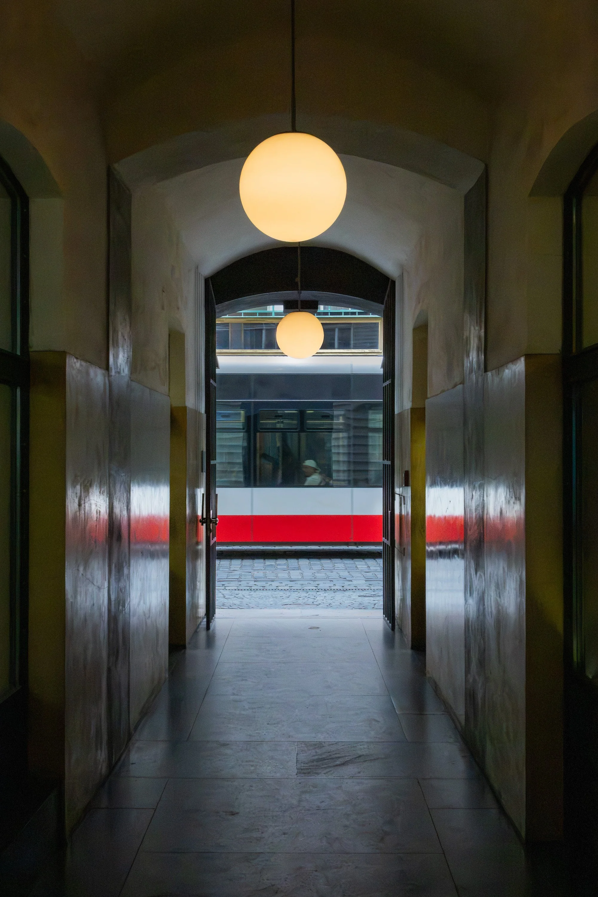 Interior hallway in Prague with repeating architectural lines and deep perspective