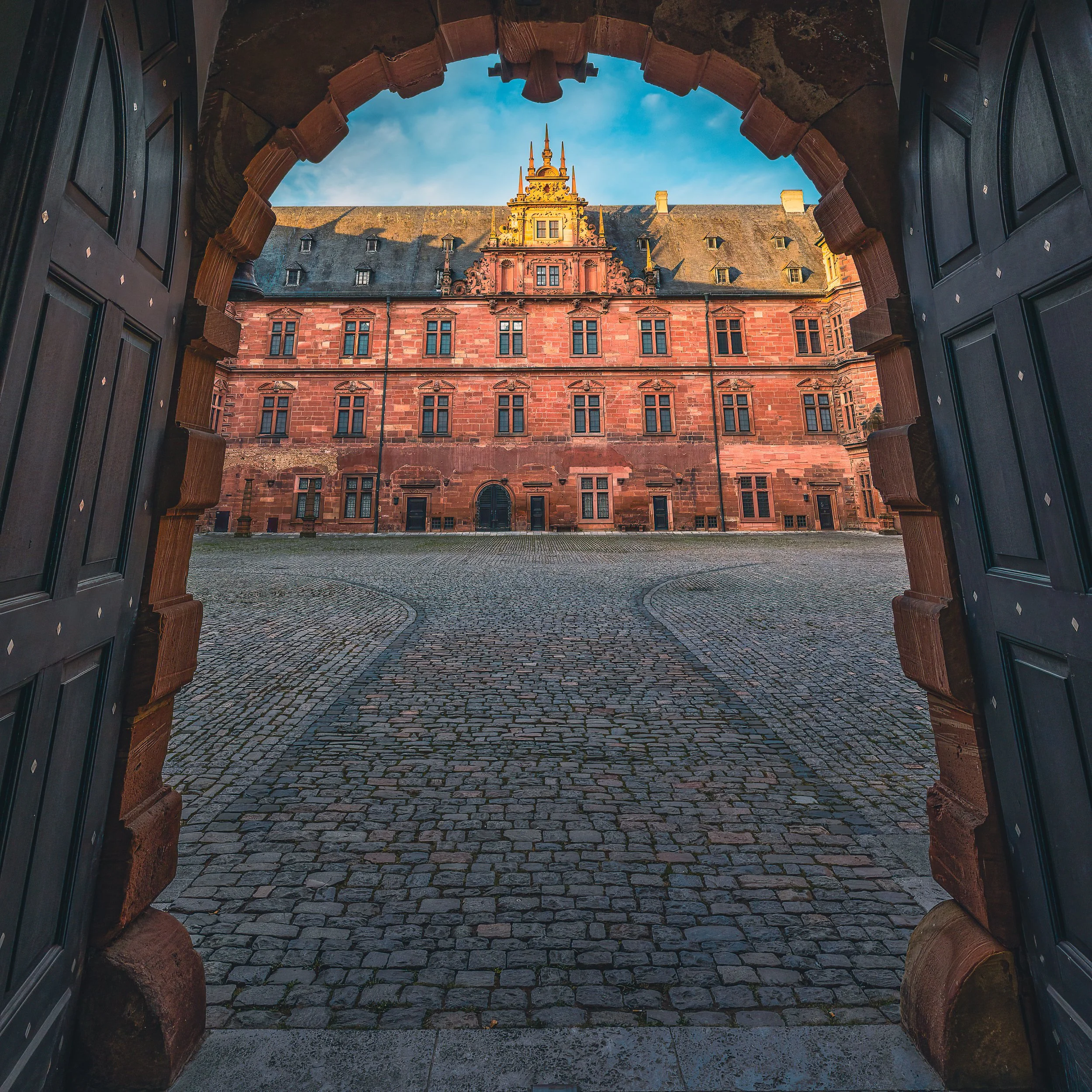 Historic architecture in Aschaffenburg framed by surrounding buildings
