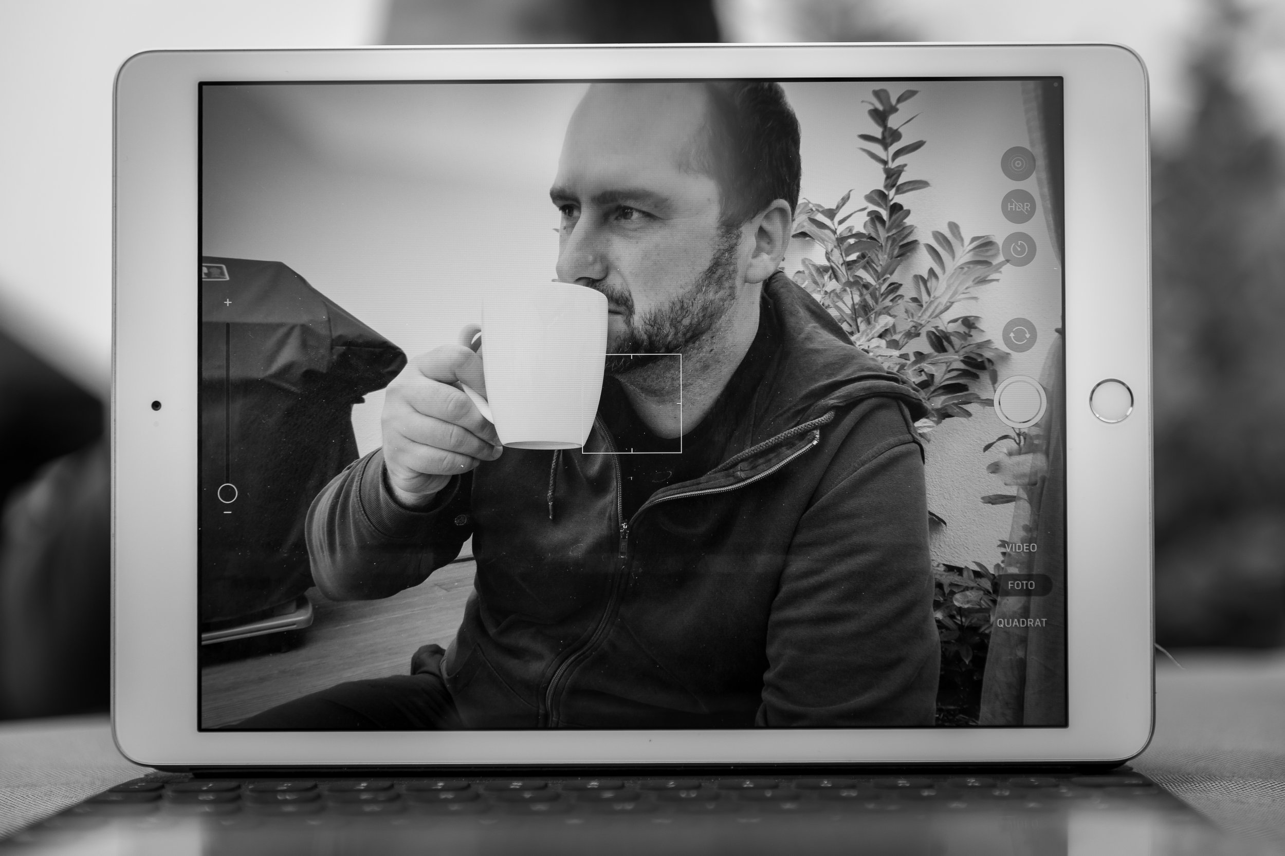 Michael Knaf having coffee in a garden