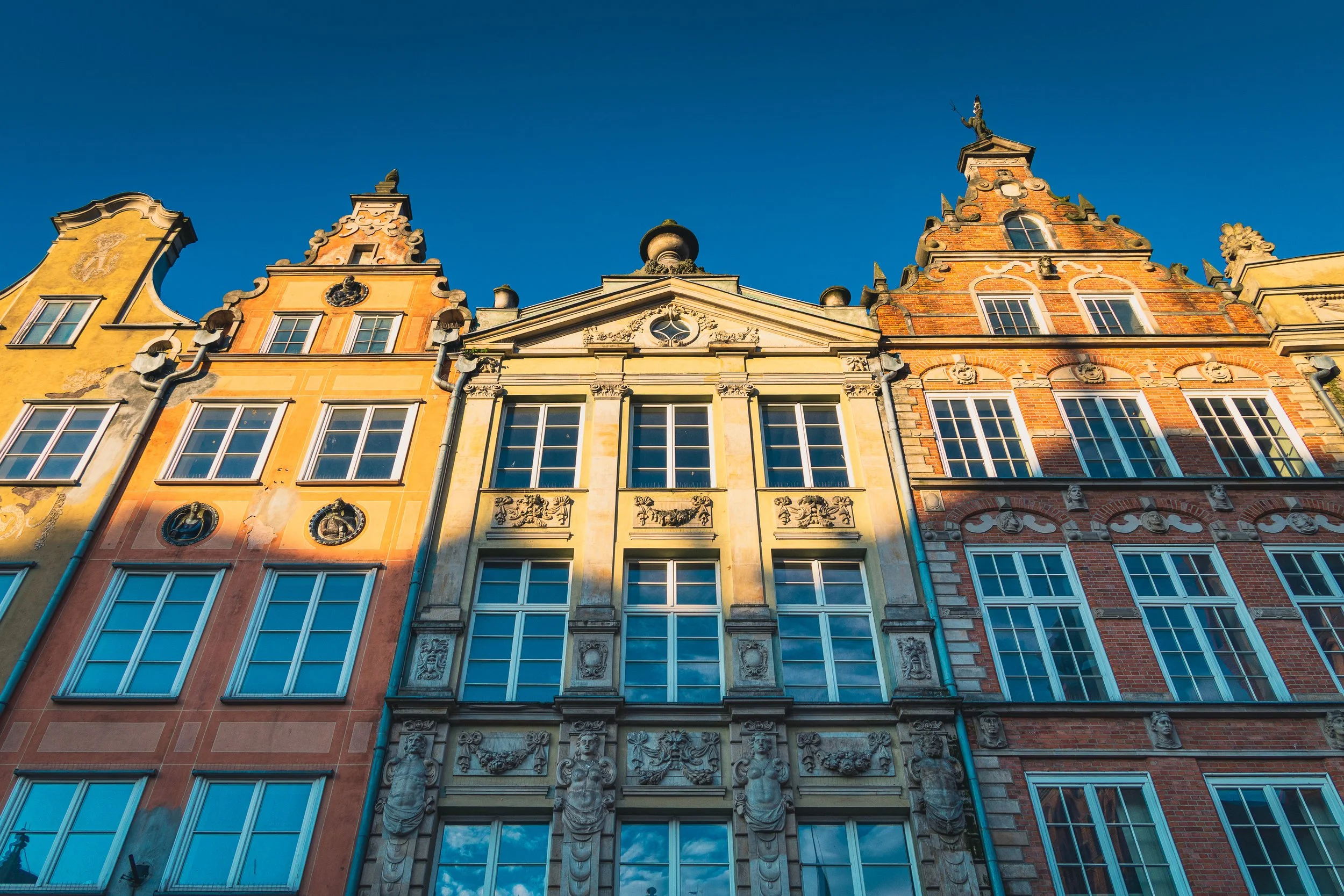Repeating colorful facades of historic houses in Gdańsk