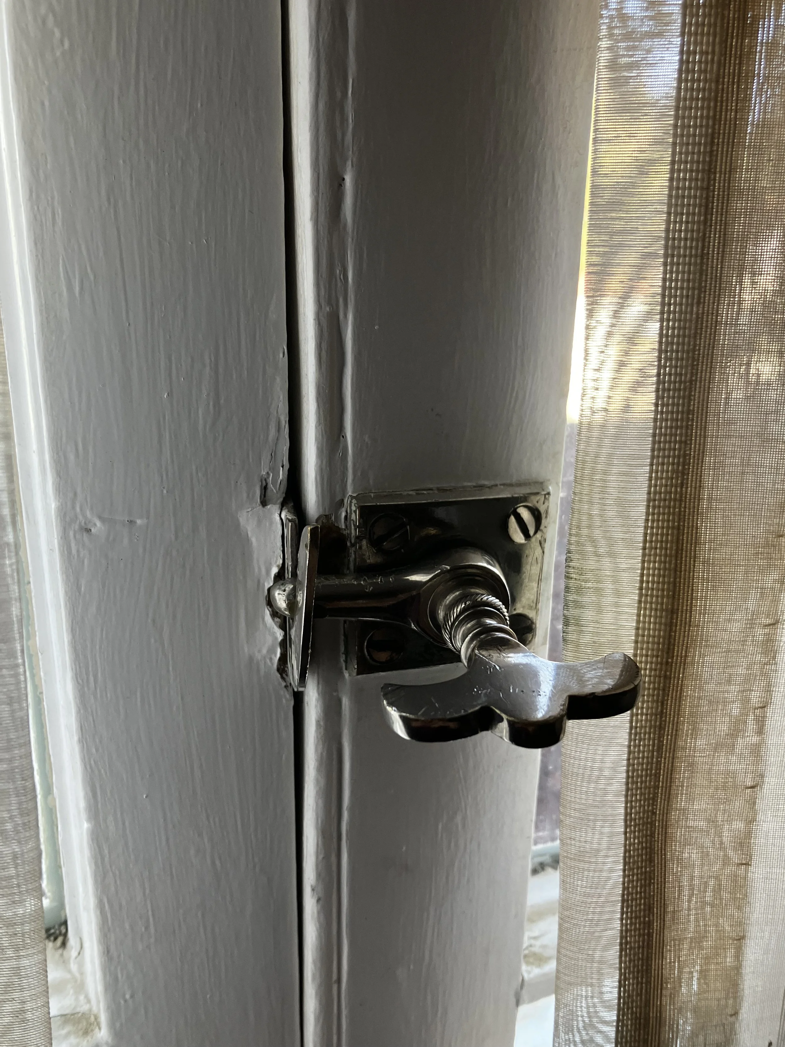 The bathroom window latch. Guests report the window slamming open on its own. 