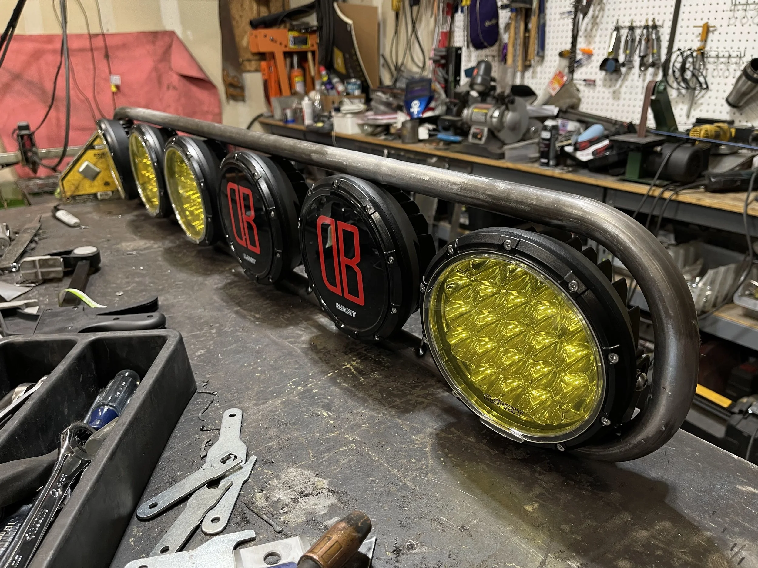 Custom light bar for a side by side with an oval shape and 5 lights attached