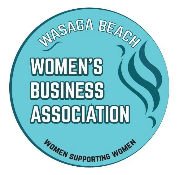 Circular logo for Wasaga Beach Women's Business Association featuring the organization name, a crescent moon, stylized waves, and the tagline "Women supporting women".